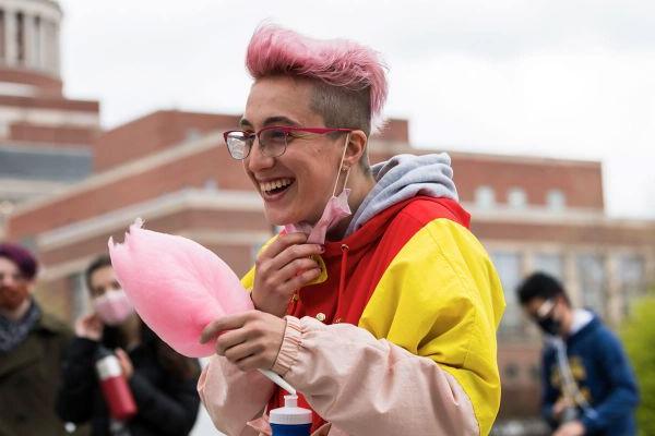 Student sitting on campus of Unversity of Rochester